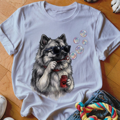 A white crewneck t-shirt featuring a graphic of a fluffy grey dog wearing sunglasses and blowing bubbles.