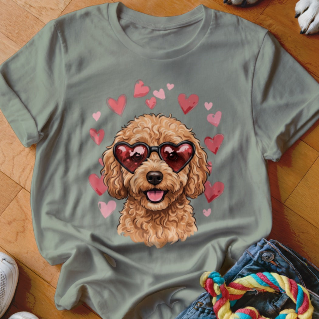 Sage green t-shirt featuring a fluffy poodle wearing heart-shaped sunglasses, surrounded by pink hearts.