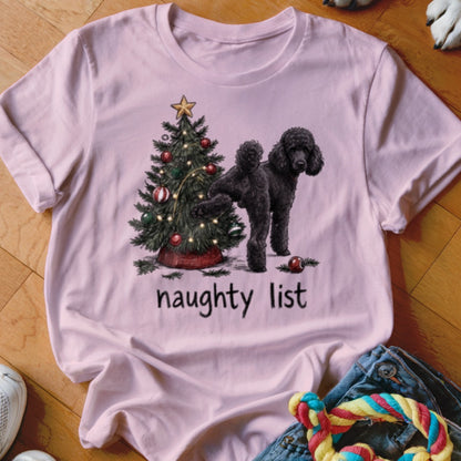 Pink t-shirt with a black poodle and Christmas tree graphic that reads "naughty list".