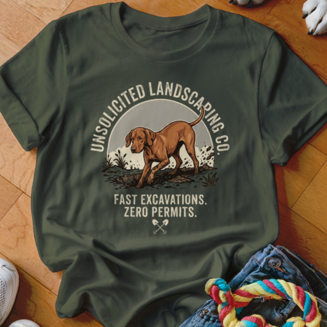 Green t-shirt with a dog digging and text "Unsolicited Landscaping Co. Fast Excavations. Zero Permits."