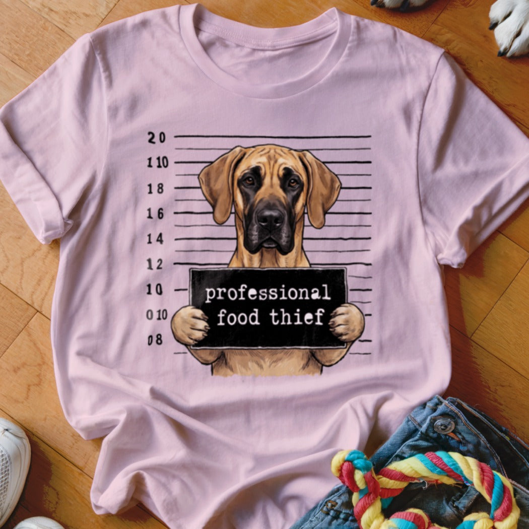 Great Dane mugshot graphic with text "professional food thief" on pink t-shirt.