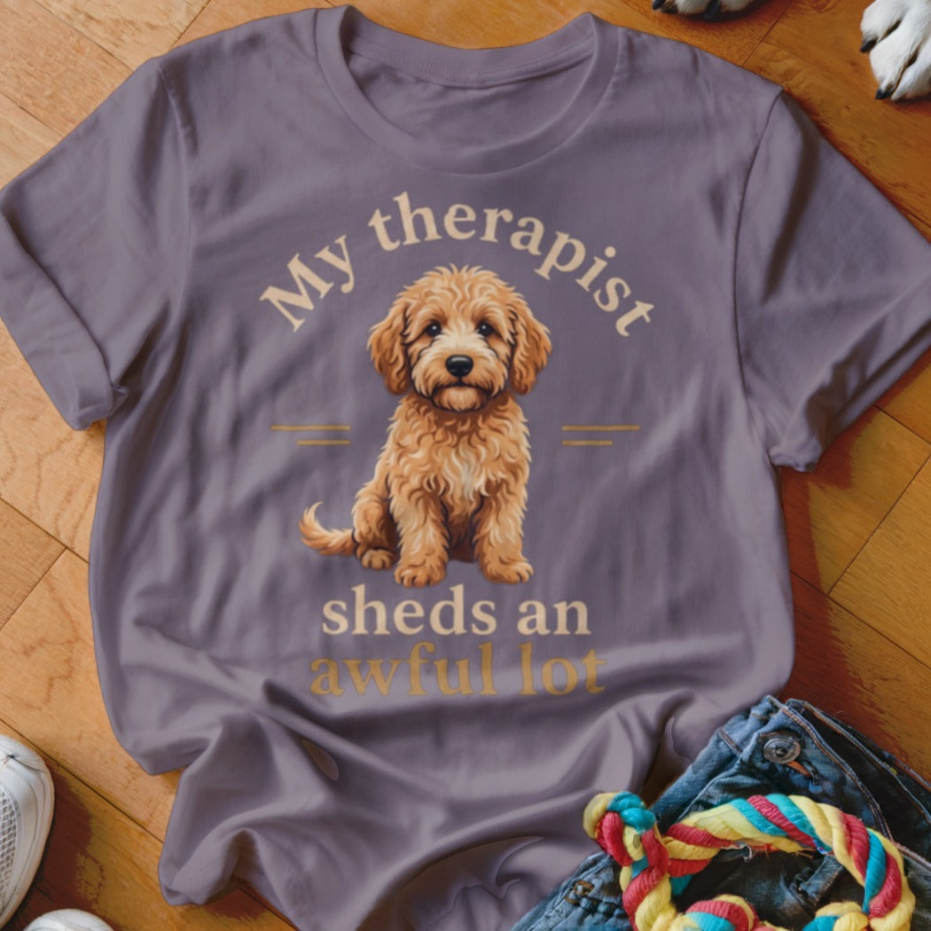 T-shirt with a fluffy dog and text "My therapist sheds an awful lot".
