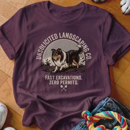 Maroon t-shirt with a collie dog and text "UNSOLICITED LANDSCAPING CO. FAST EXCAVATIONS. ZERO PERMITS."