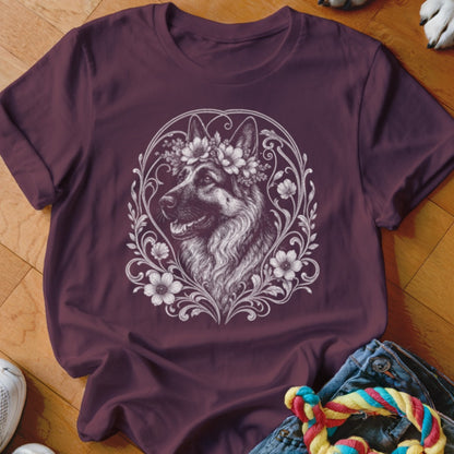 Burgundy t-shirt with a German Shepherd dog wearing a floral crown in ornamental detail.