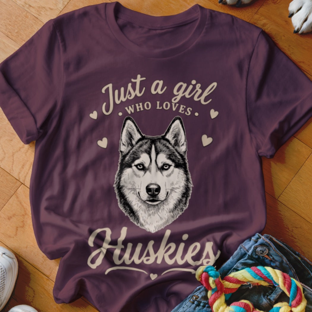 Maroon t-shirt featuring a sketch of a husky face and the text "Just a girl who loves Huskies".