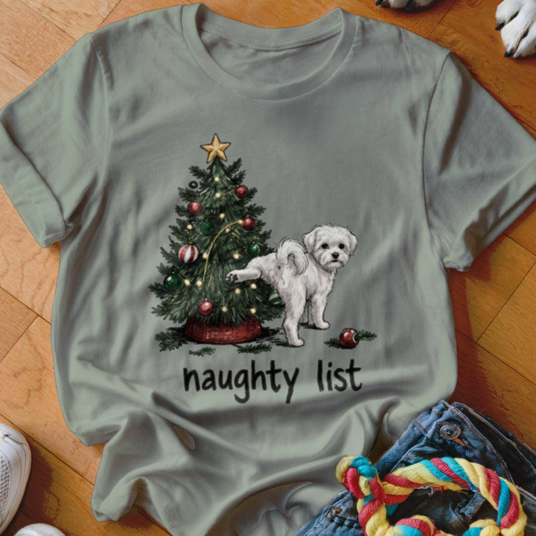 White dog next to a Christmas tree with text "naughty list".