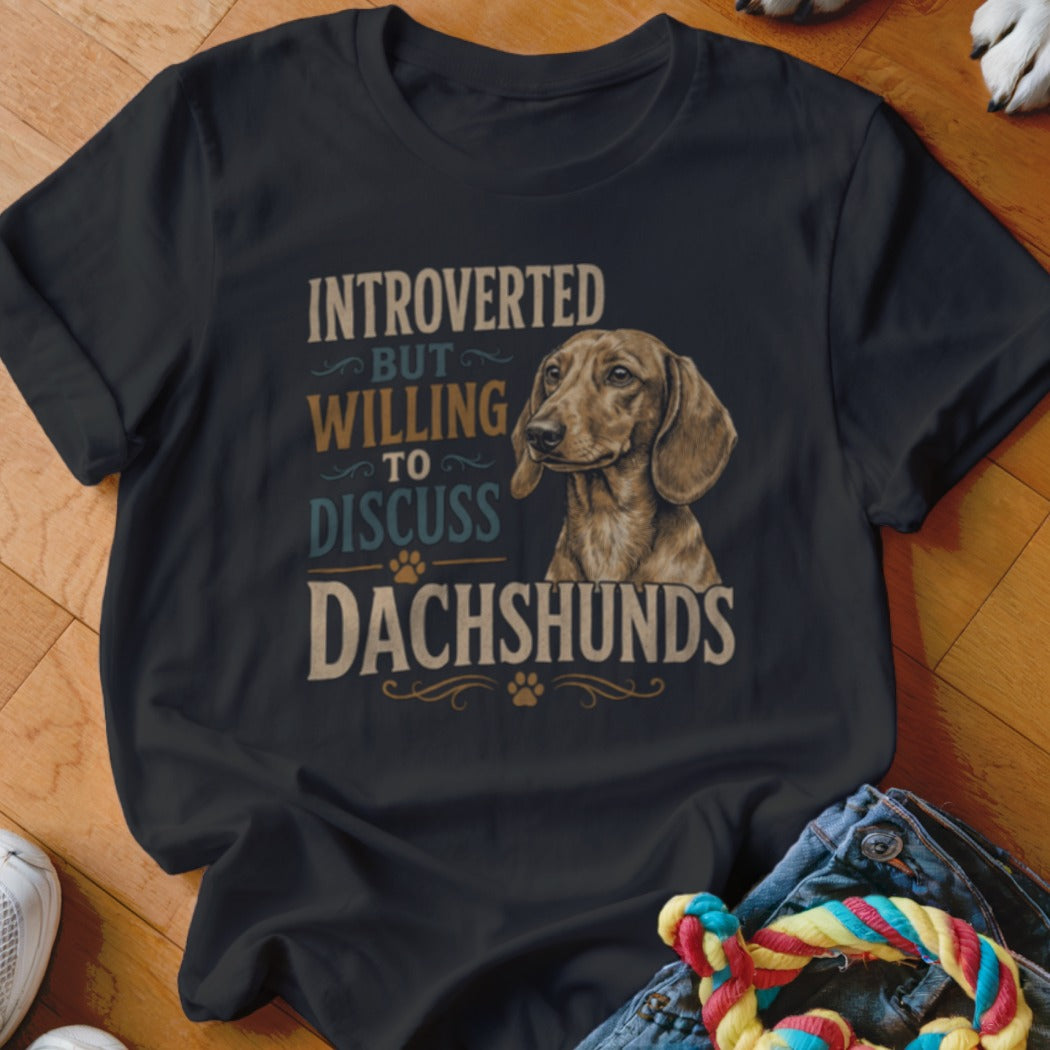 Black t-shirt with "Introverted But Willing to Discuss Dachshunds" text and a dachshund illustration.