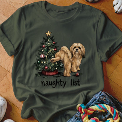 Brown dog with paw on Christmas tree; text "naughty list" below.