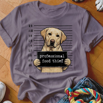 Yellow lab dog mugshot sign reads "professional food thief"
