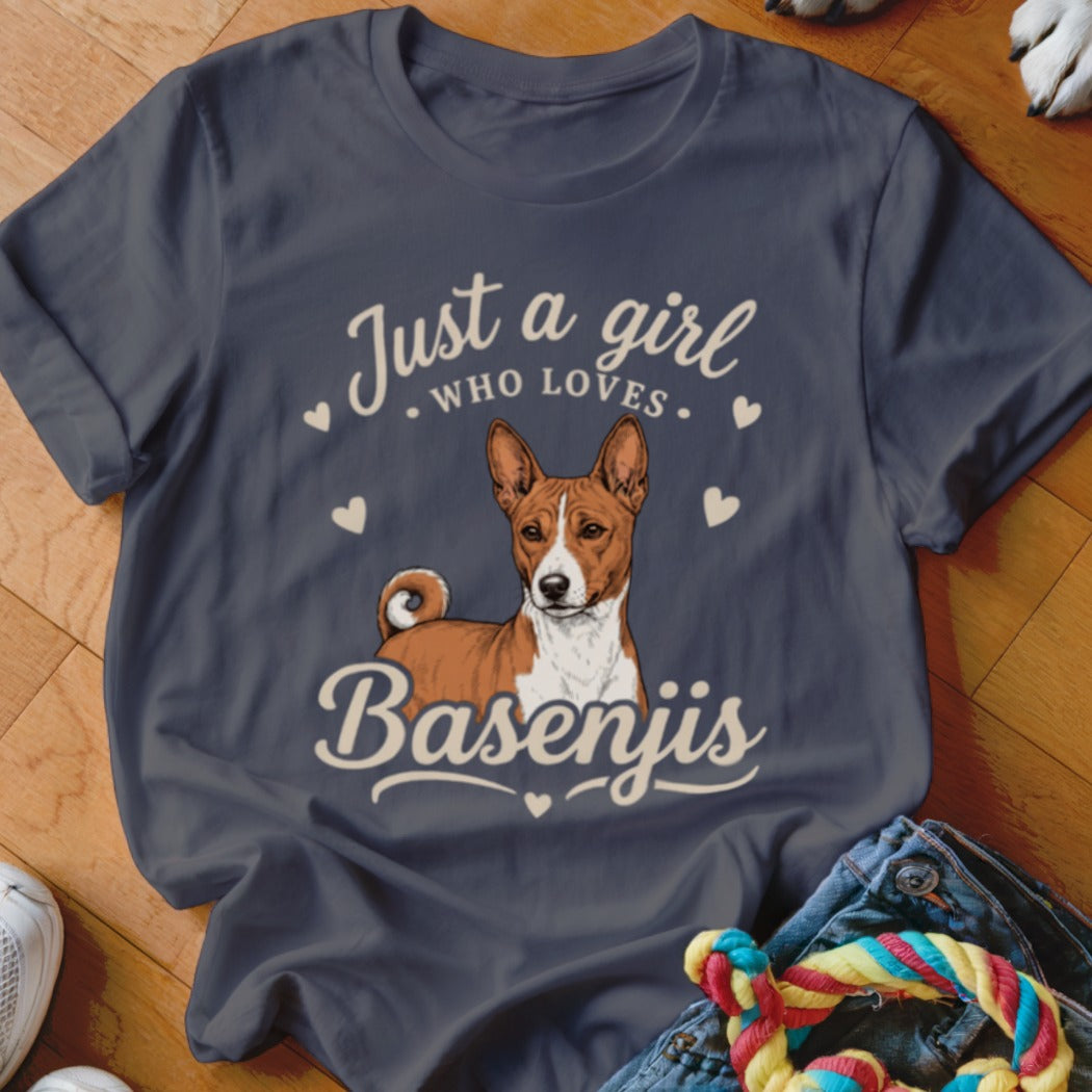 A dark gray t-shirt with an illustration of a Basenji dog and the text "Just a girl who loves Basenjis."