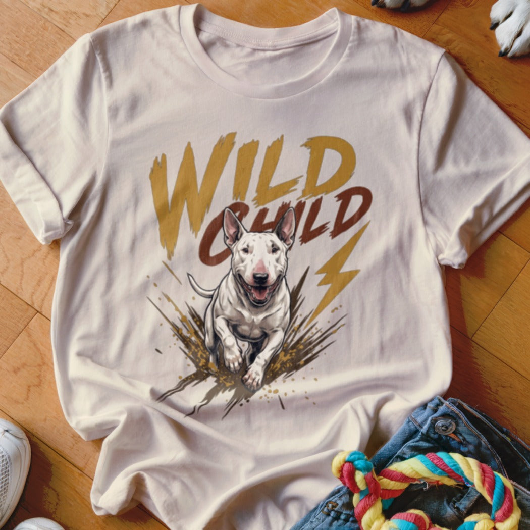 A cream-colored t-shirt with a graphic of a running Bull Terrier, mud splatters, and the text "WILD CHILD".