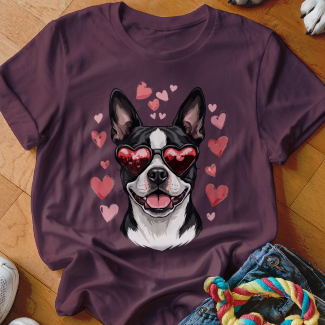 Maroon t-shirt featuring a graphic of a Boston Terrier wearing heart-shaped sunglasses surrounded by floating pink hearts.