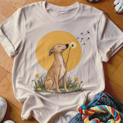 A light-colored t-shirt features a graphic of a dog sitting in grass, blowing dandelion seeds.
