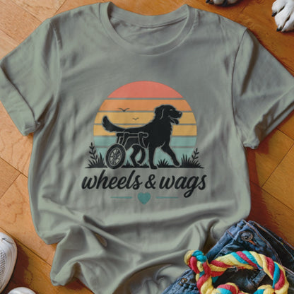 Black dog in a wheelchair with "wheels & wags" text and a heart.