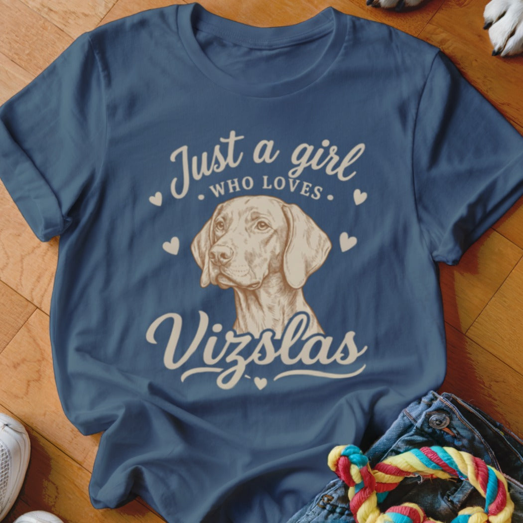 A blue t-shirt featuring a graphic of a Vizsla dog and the text Just a girl who loves Vizslas.