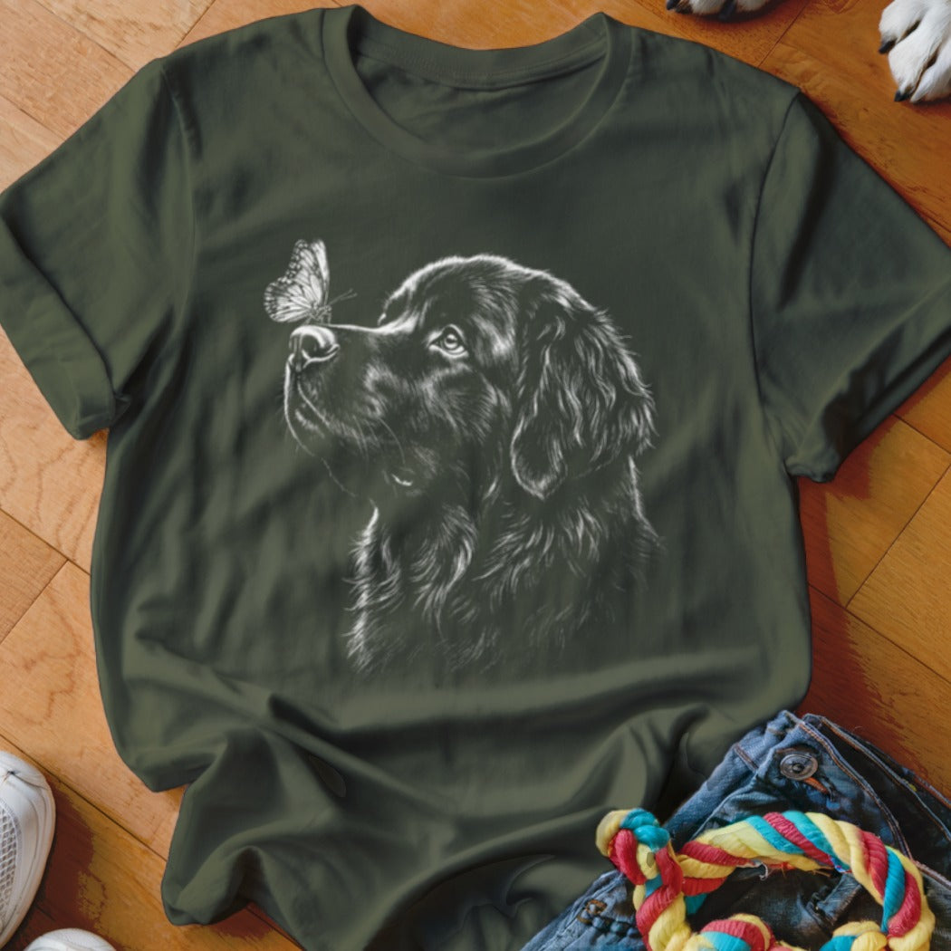 Dark green crewneck t-shirt featuring a white graphic of a dog looking at a butterfly.