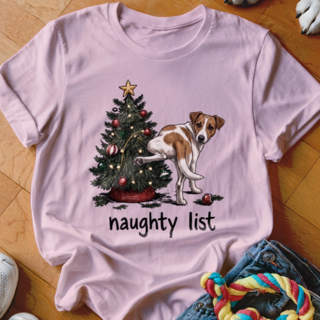 Pink t-shirt with a Christmas tree and dog illustration reading "naughty list".