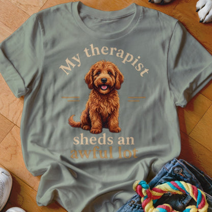 Light grey t-shirt with a doodle dog graphic and text "My therapist sheds an awful lot".