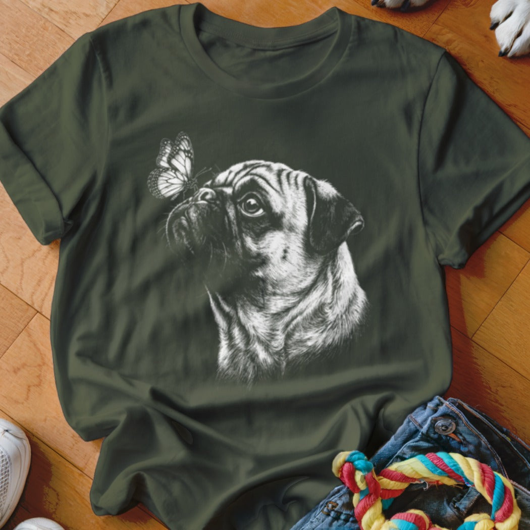 Dark green crewneck t-shirt featuring a white sketch graphic of a pug looking at a butterfly.