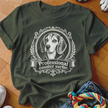Olive t-shirt with beagle illustration and "Professional counter surfer." text.