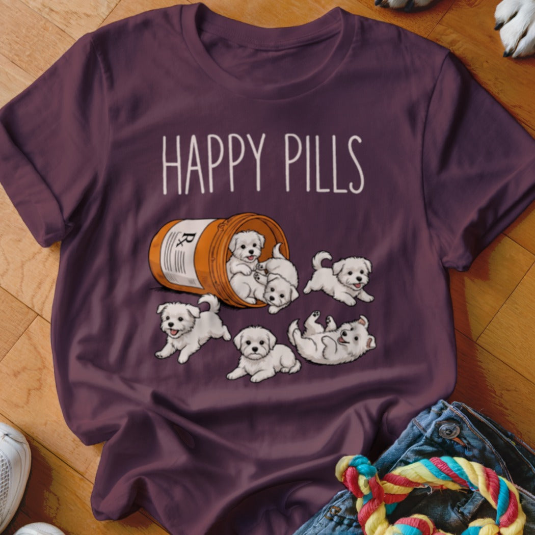 T-shirt with "HAPPY PILLS" text and fluffy white puppies spilling from a pill bottle.