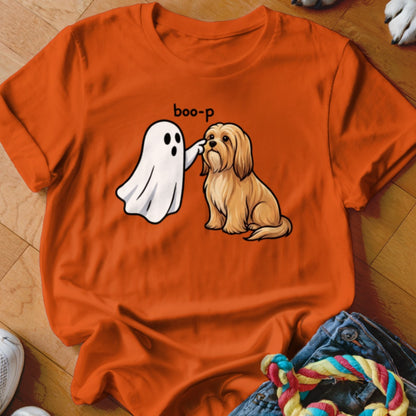 Ghost booping a tan dog with text "boo-p" on orange t-shirt.