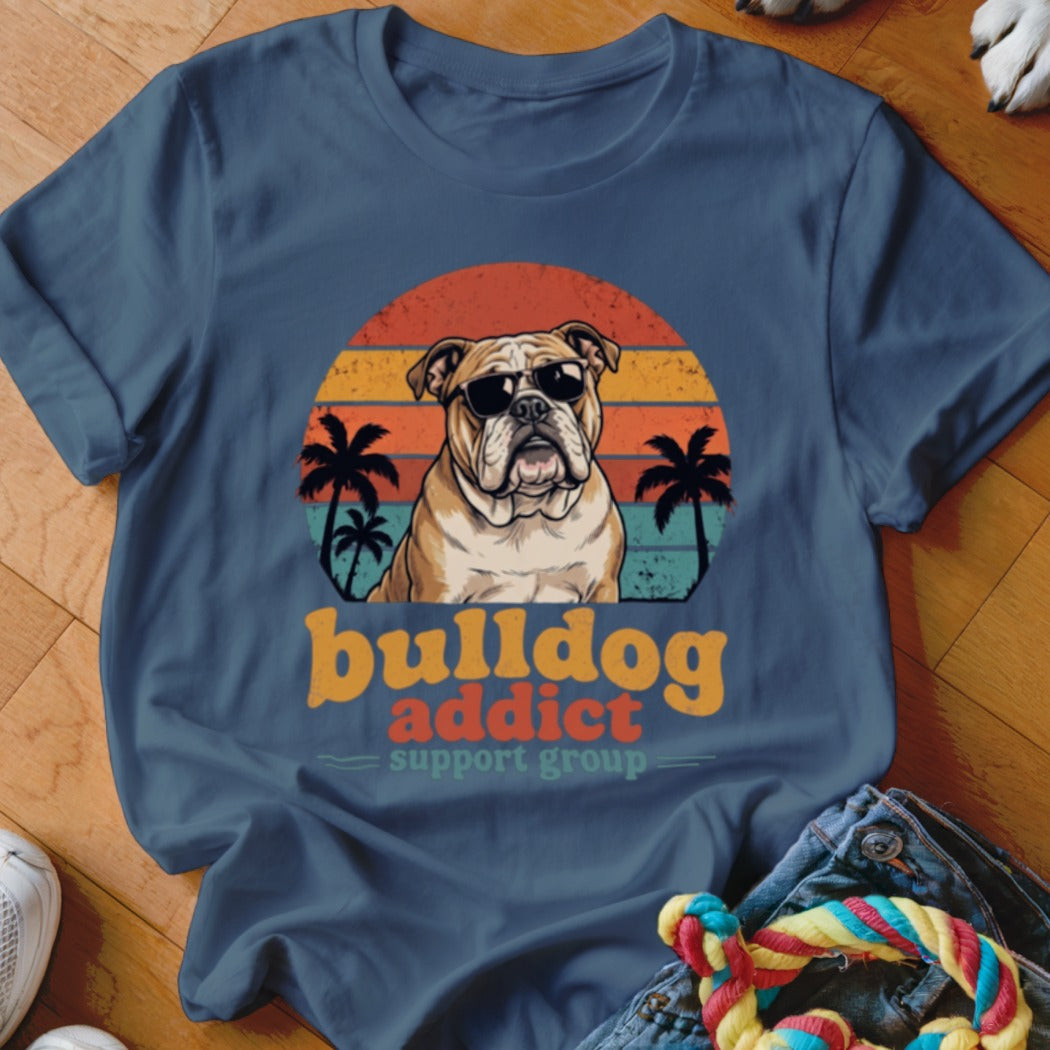 A blue t-shirt featuring a retro graphic of a bulldog wearing sunglasses with the text bulldog addict support group.