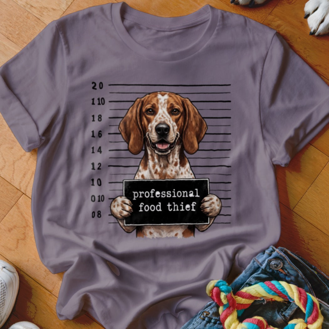 T-shirt with a dog mugshot holding a sign that says "professional food thief".