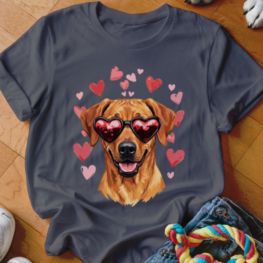 A dark grey t-shirt featuring a graphic of a golden retriever wearing heart-shaped sunglasses surrounded by pink and red hearts.