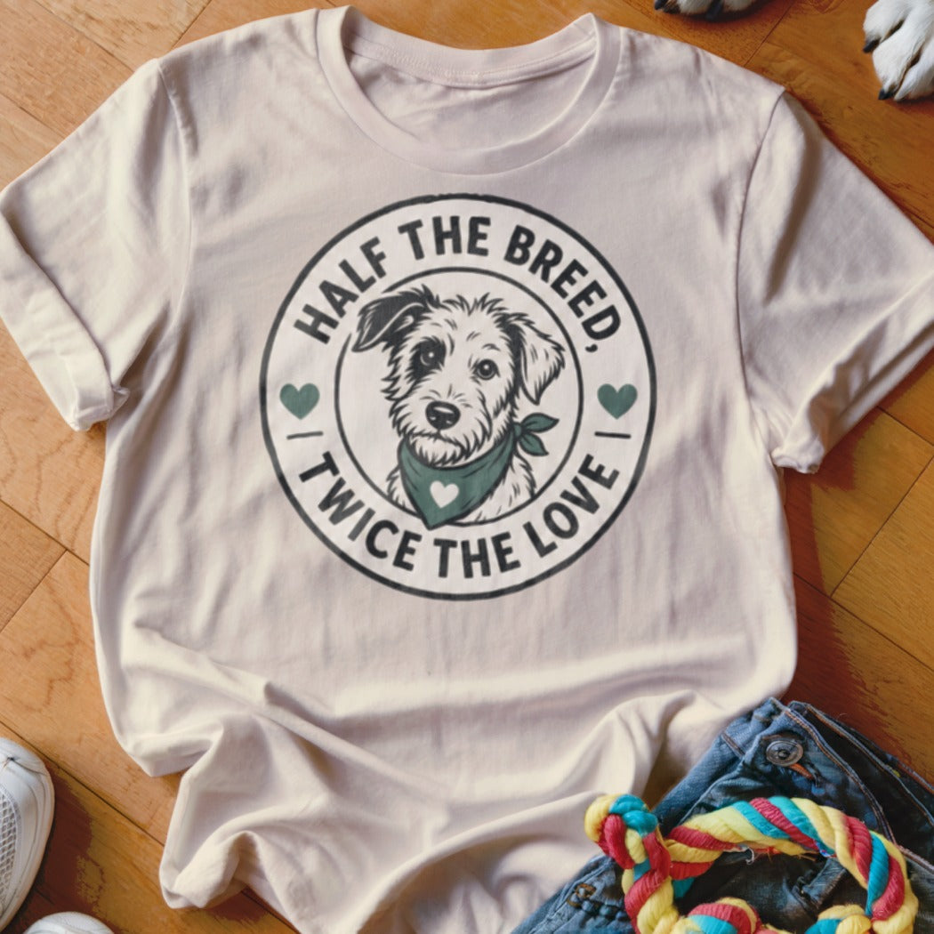 Cream t-shirt with a circular graphic of a dog and text "Half the breed, twice the love".