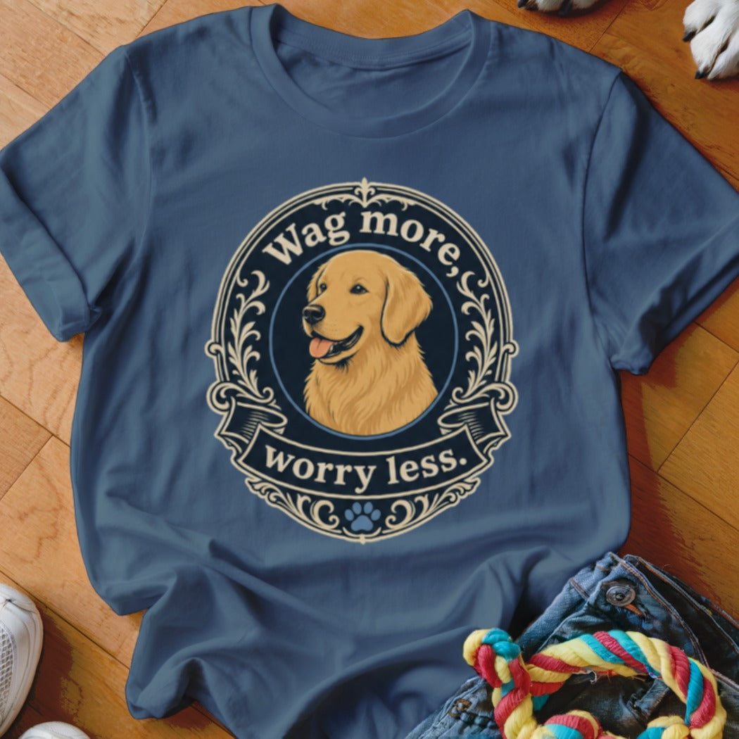 Golden Retriever with text "Wag more, worry less." on a blue t-shirt.