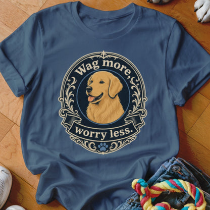 Golden Retriever with text "Wag more, worry less." on a blue t-shirt.