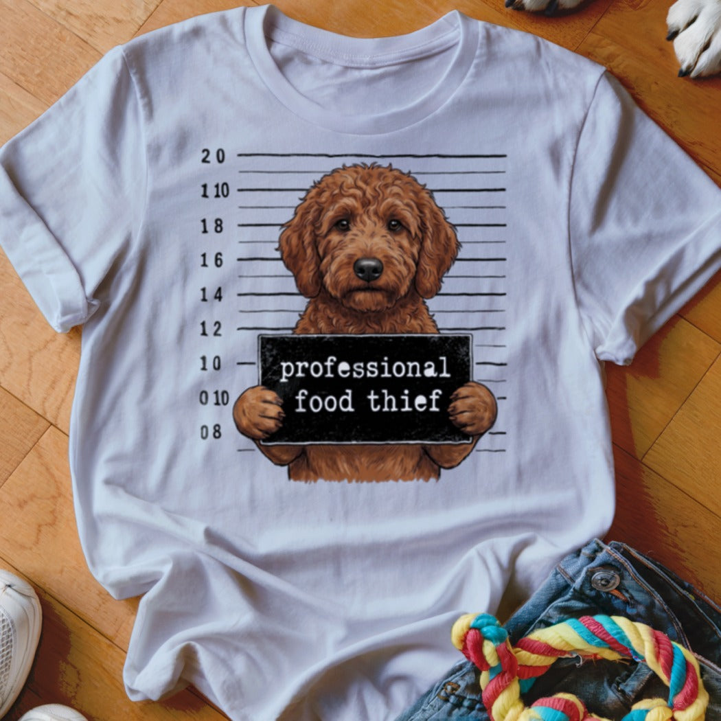 Goldendoodle mugshot with "professional food thief" sign and height markers.