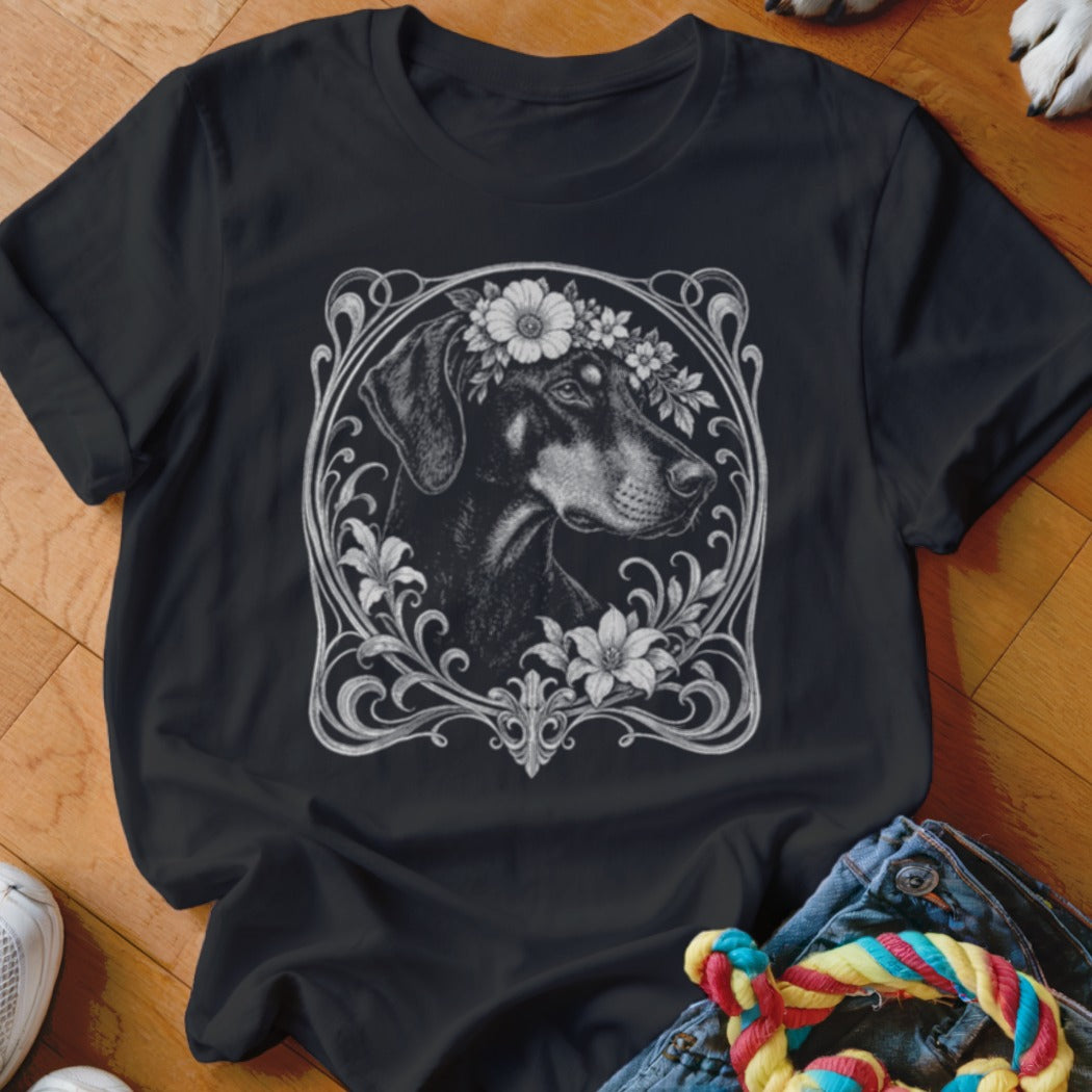 Black t-shirt with a Doberman wearing a flower crown in an ornate frame.