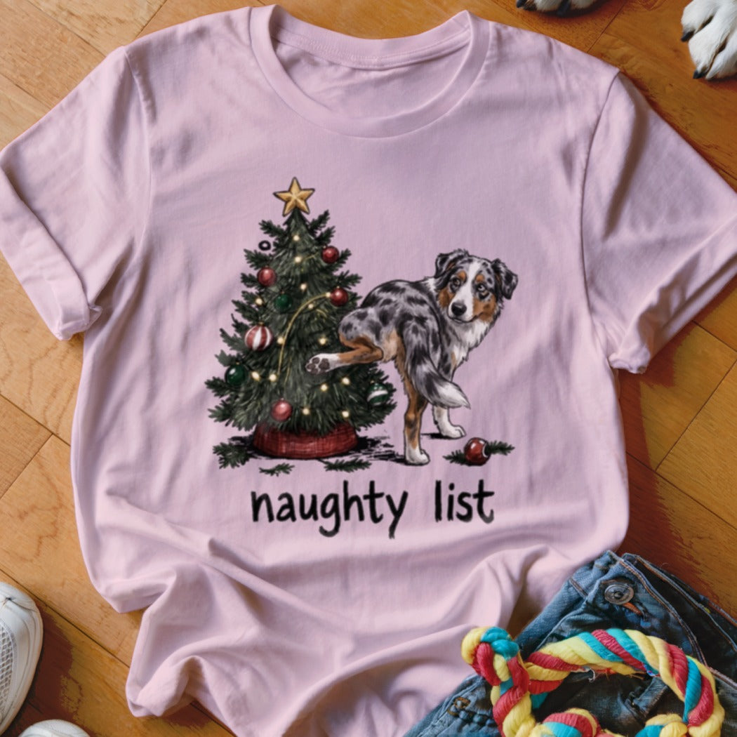 A dog is peeing on a Christmas tree with the words "naughty list".