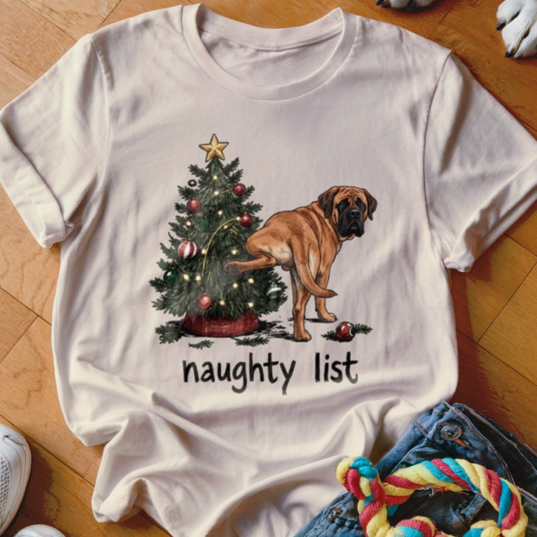 Brown dog by a Christmas tree with text "naughty list".
