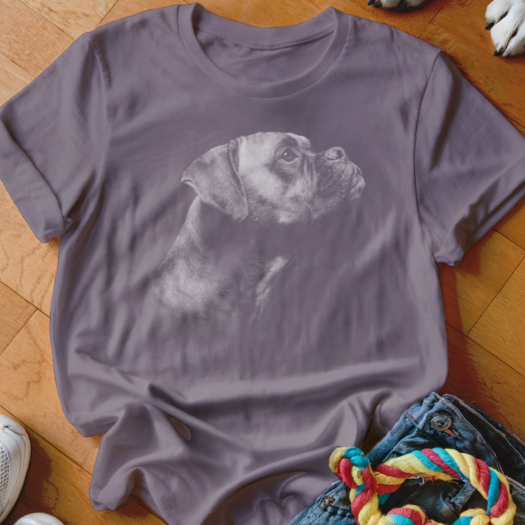 Grey t-shirt with a white Boxer dog portrait, lying on a wooden floor.