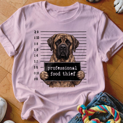 Mastiff dog in mugshot, holding sign: "professional food thief".