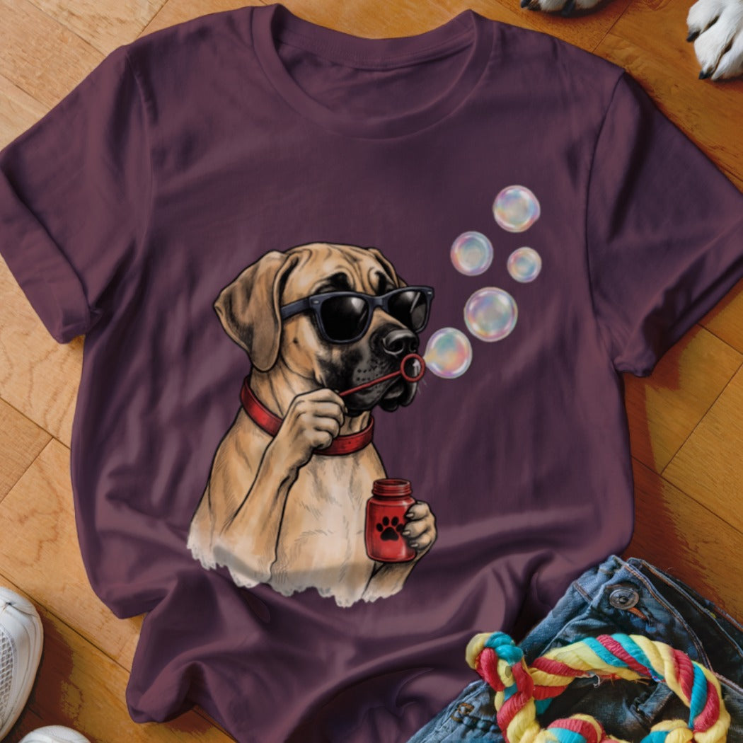Maroon t-shirt featuring a graphic of a dog wearing sunglasses blowing bubbles from a jar.