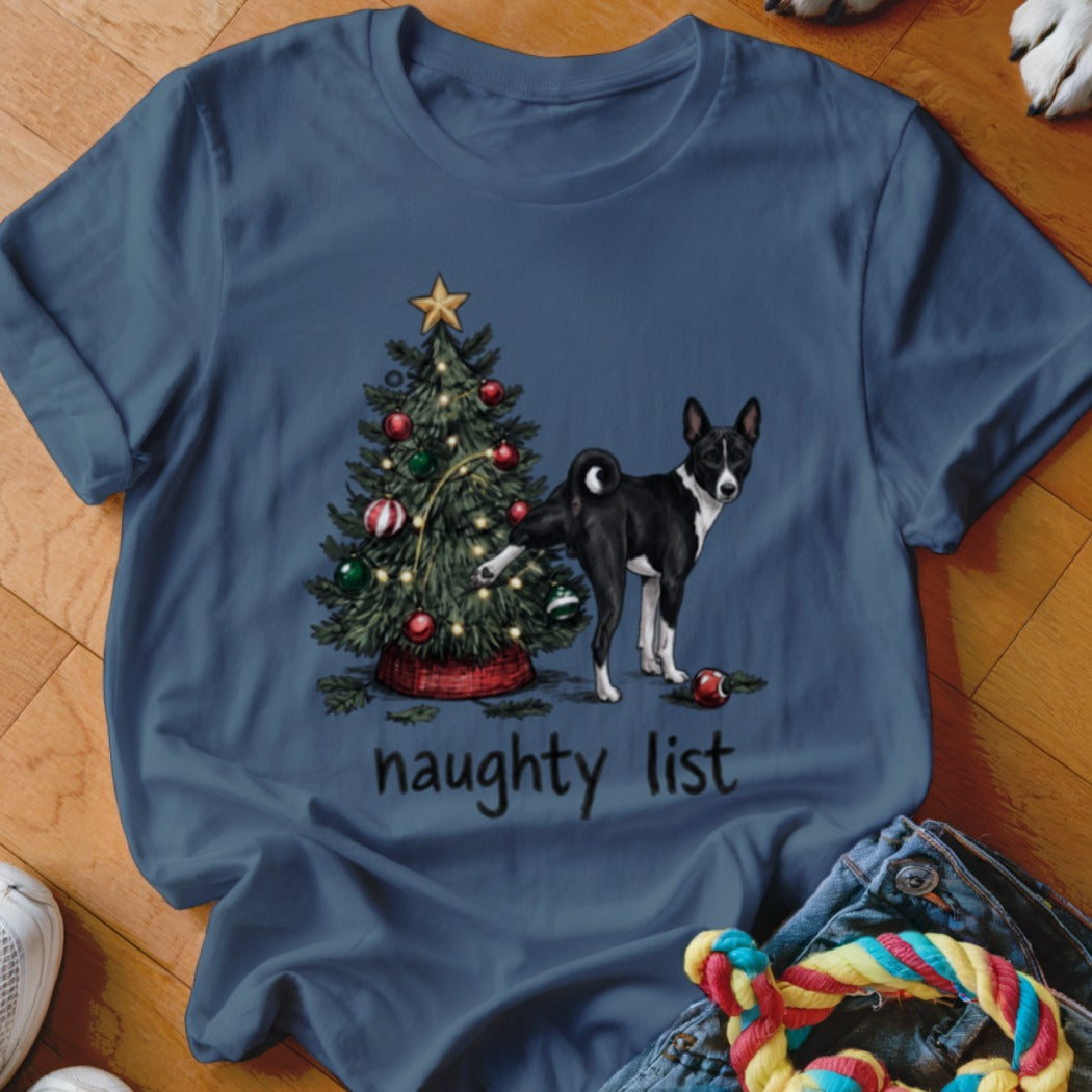 Dark blue crewneck t-shirt featuring a Basenji dog peeing on a decorated Christmas tree with the text naughty list underneath.
