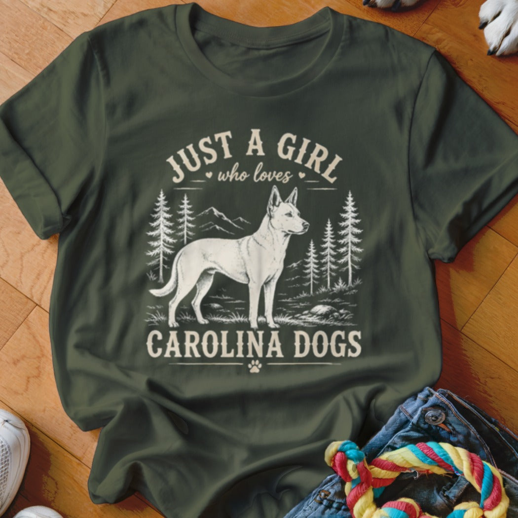 Green t-shirt with white graphic of a Carolina Dog, trees, and mountains.