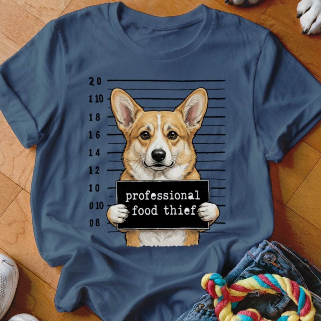 Corgi mugshot with "professional food thief" sign.