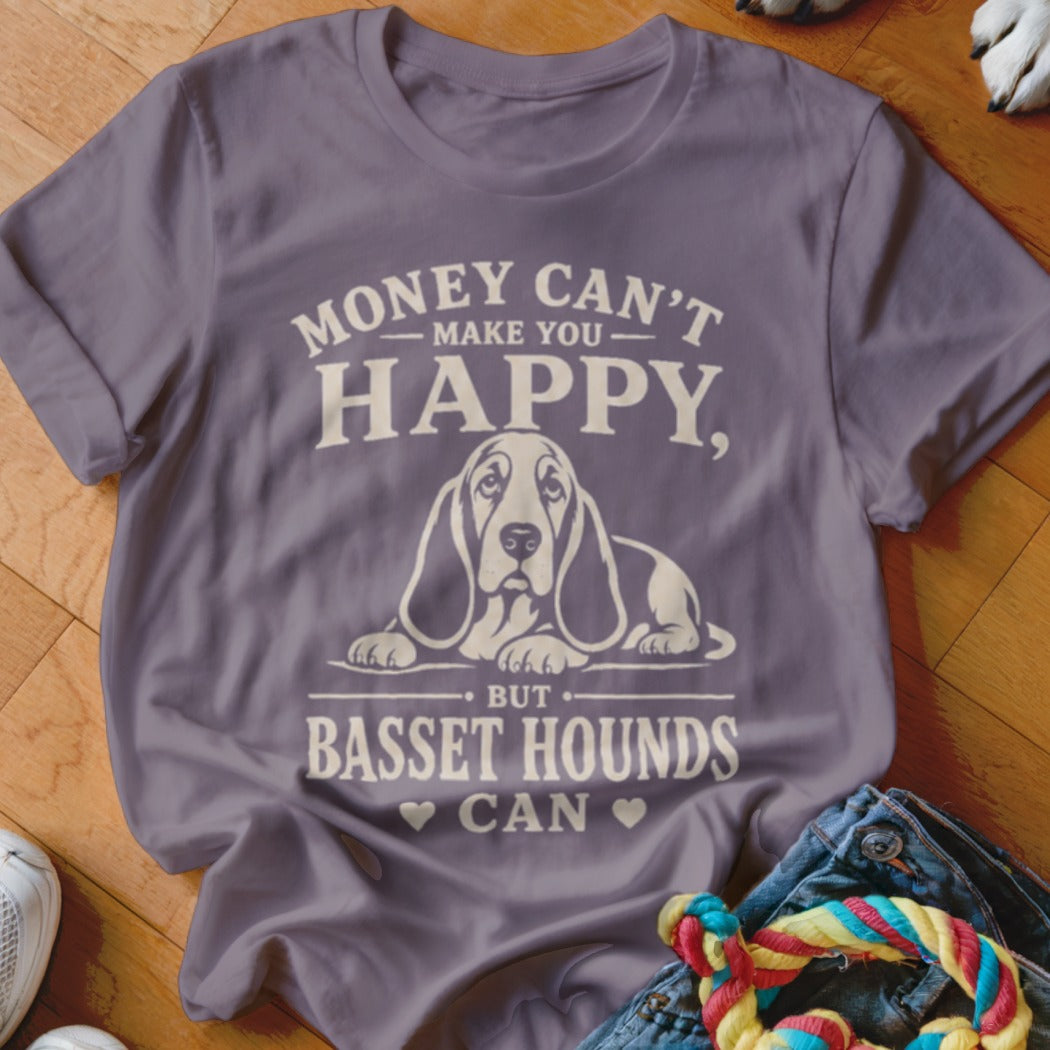 Purple t-shirt with text "Money Can't Make You Happy, But Basset Hounds Can" and a basset hound illustration.