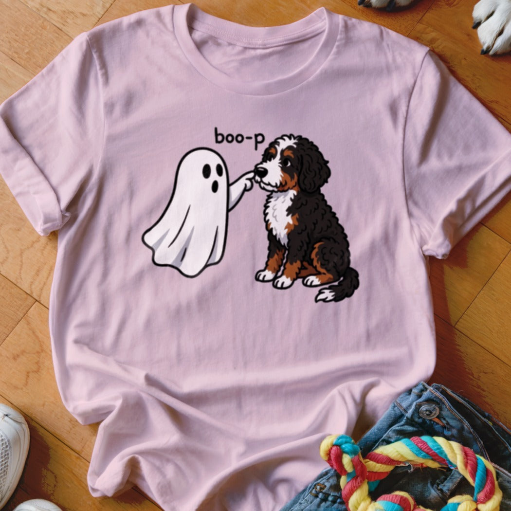 Ghost "boop"ing a Bernese Mountain Dog on a pink t-shirt.