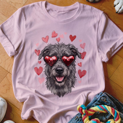 Light pink t-shirt featuring a graphic of a scruffy dog wearing heart-shaped sunglasses surrounded by pink hearts.