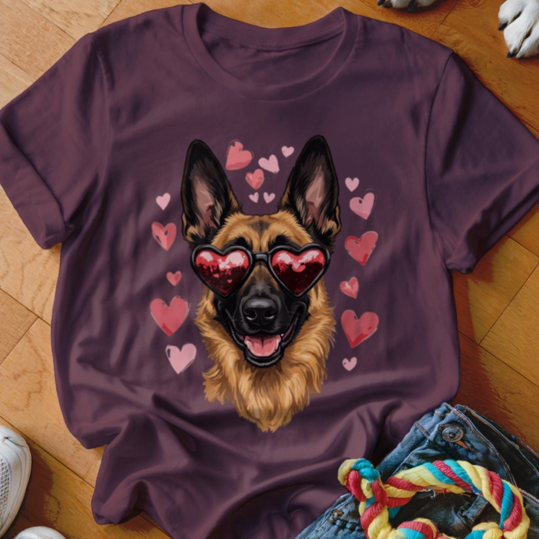 Dark purple t-shirt featuring a German Shepherd wearing heart-shaped sunglasses, surrounded by pink hearts.