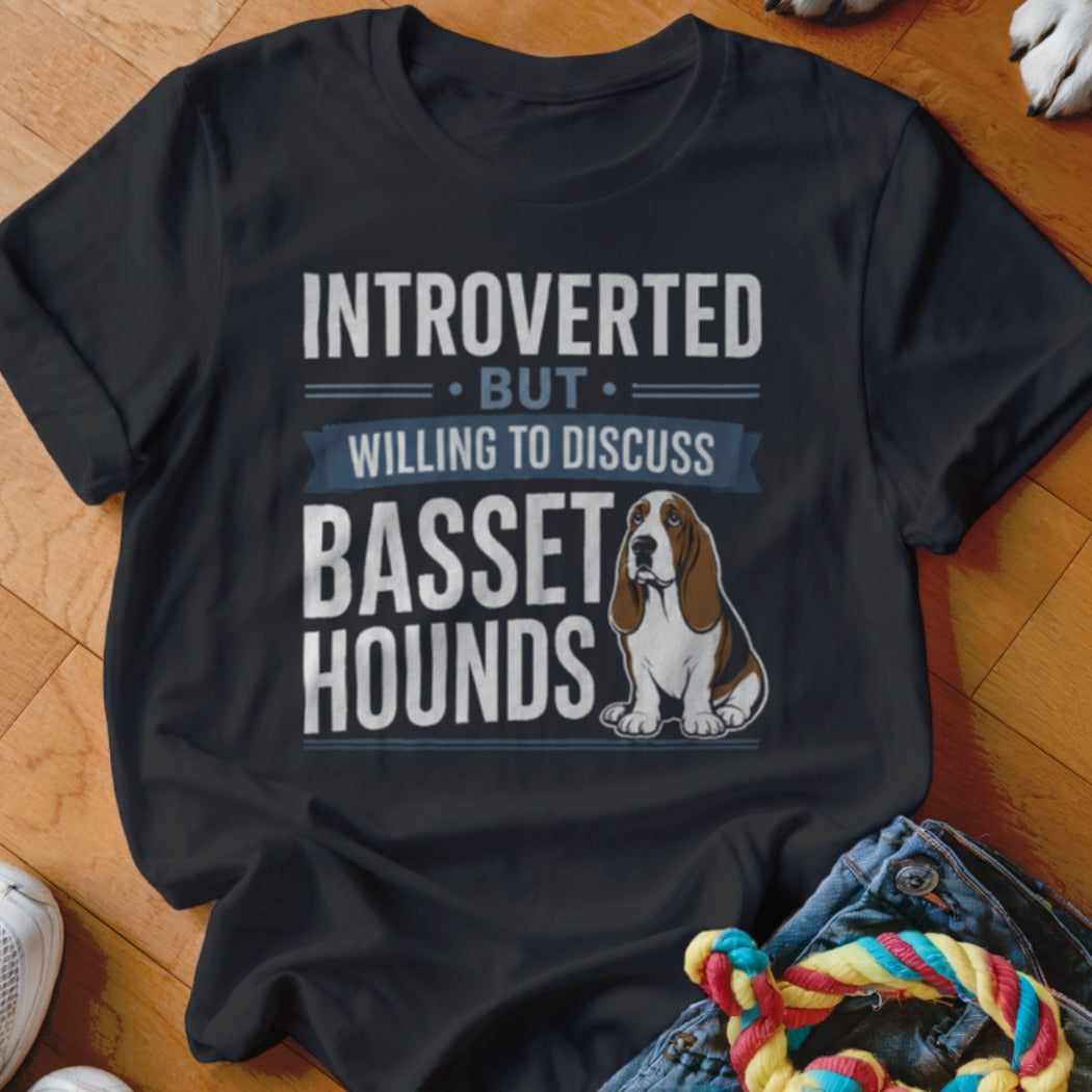 Black t-shirt with "Introverted But Willing to Discuss Basset Hounds" text and illustration.