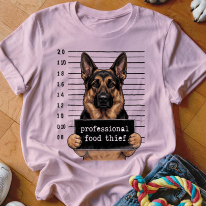 German Shepherd mugshot with "professional food thief" sign.