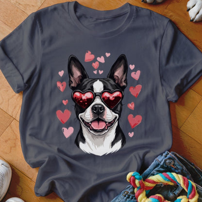 A dark gray t-shirt featuring a graphic of a Boston Terrier wearing heart-shaped sunglasses surrounded by pink hearts.