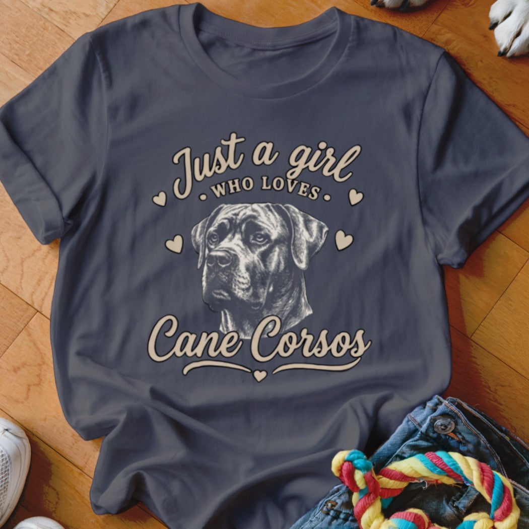 A dark gray t-shirt with a vintage-style graphic of a Cane Corso surrounded by hearts and text that reads Just a girl who loves Cane Corsos.